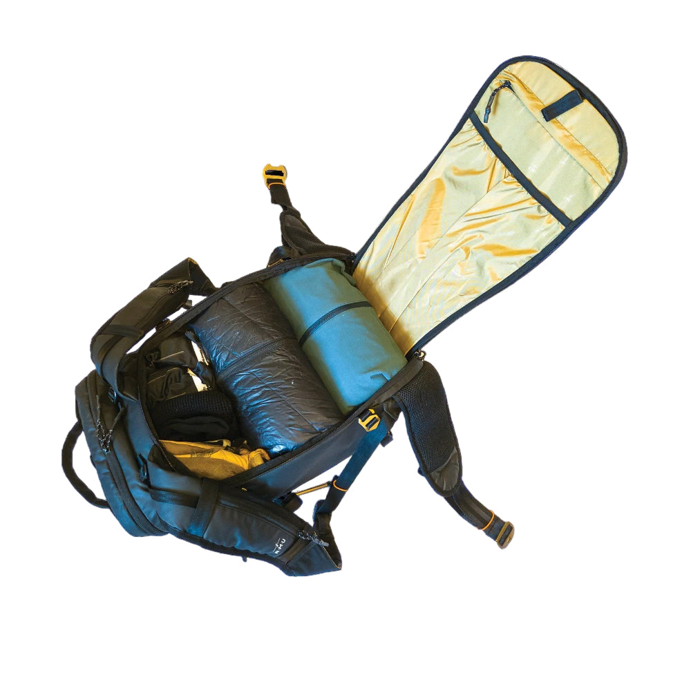 Backpack with a rolled-up sleeping pad inside on a white background