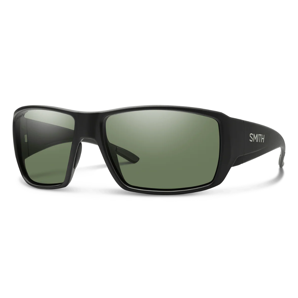 Black sunglasses with green lenses on a white background