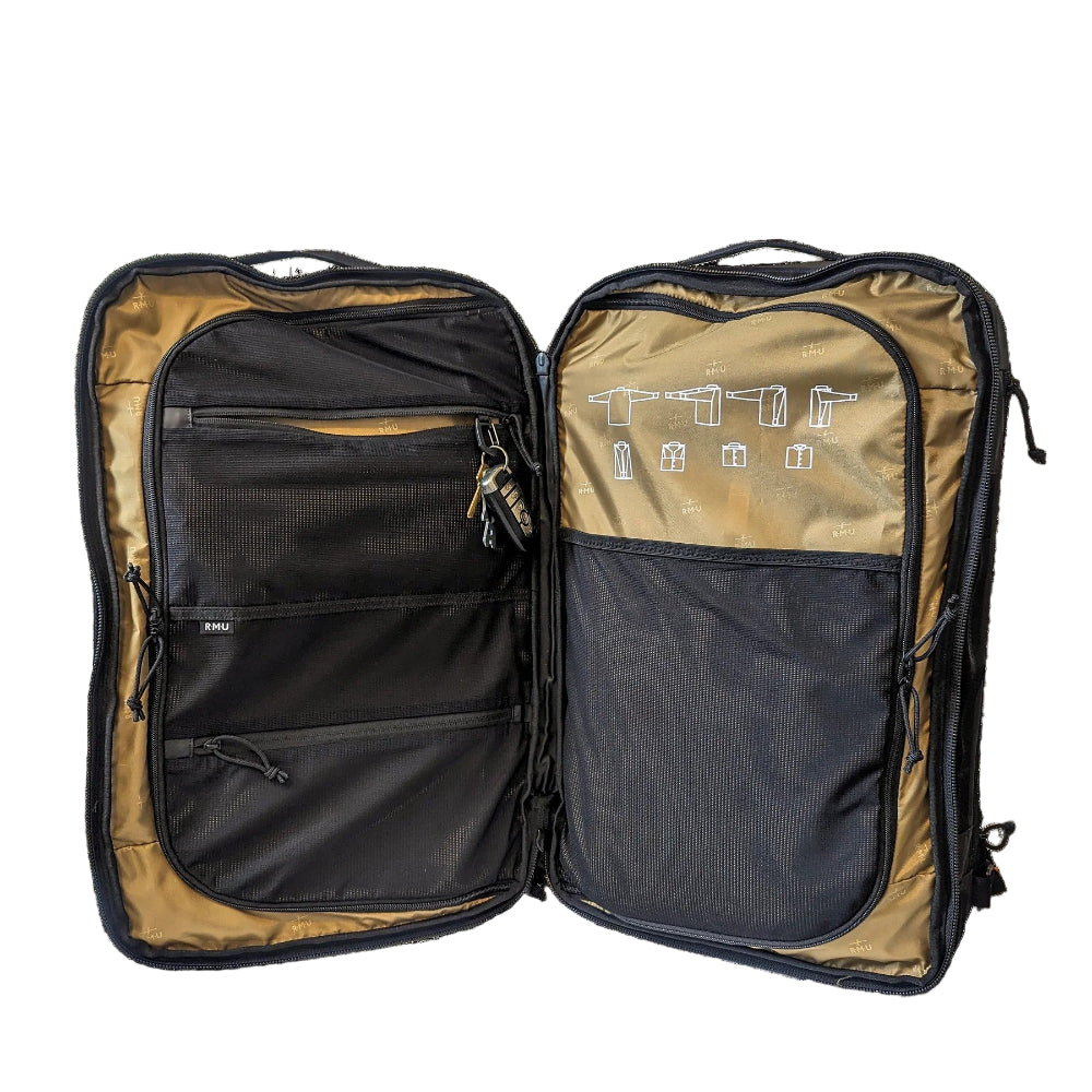 Open backpack with black interior compartments on a black background