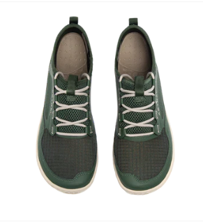 Pair of black and green sneakers on a white background