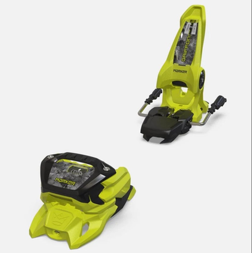 Two bright yellow ski bindings on a white background