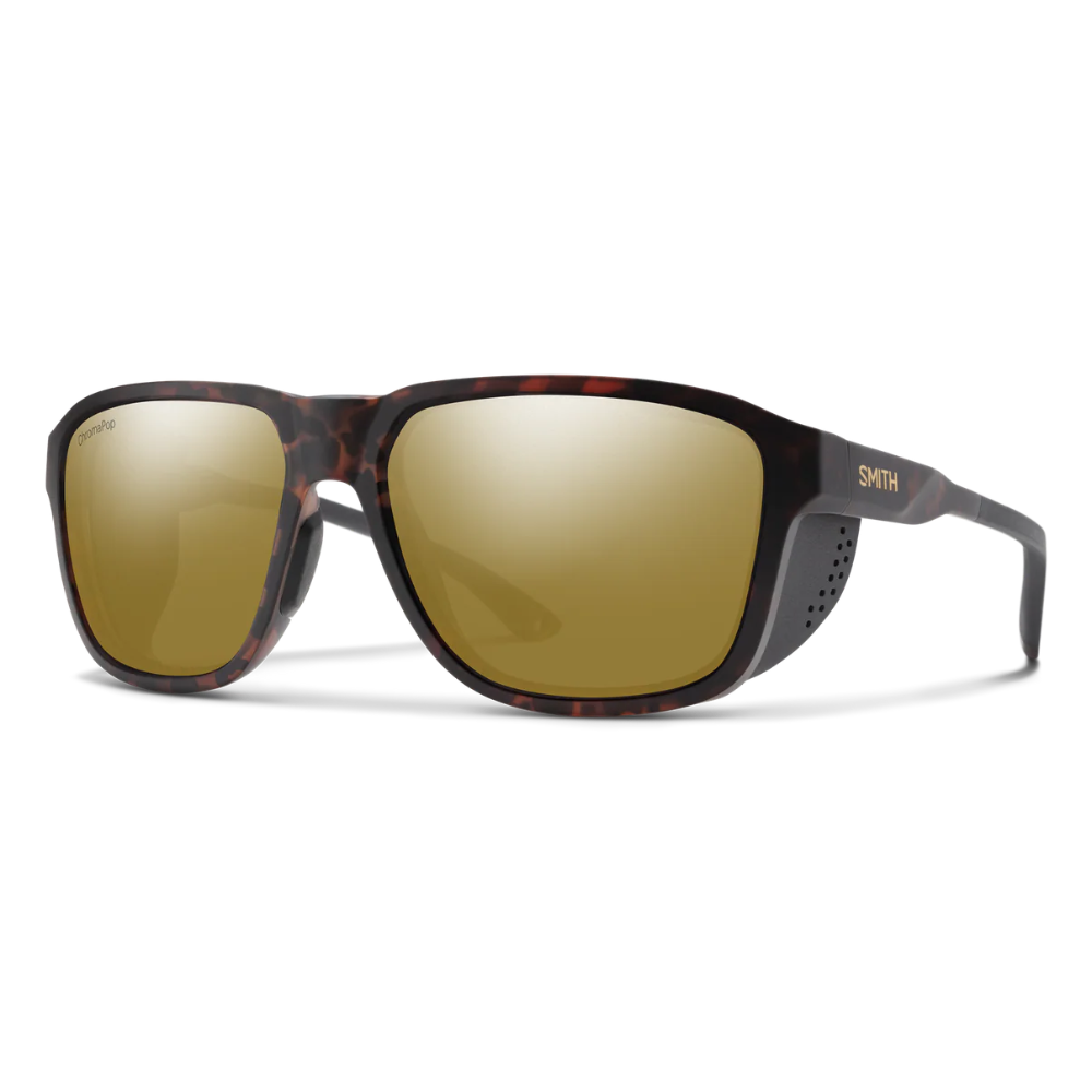 Sunglasses with tortoiseshell frame and gold lenses on a white background