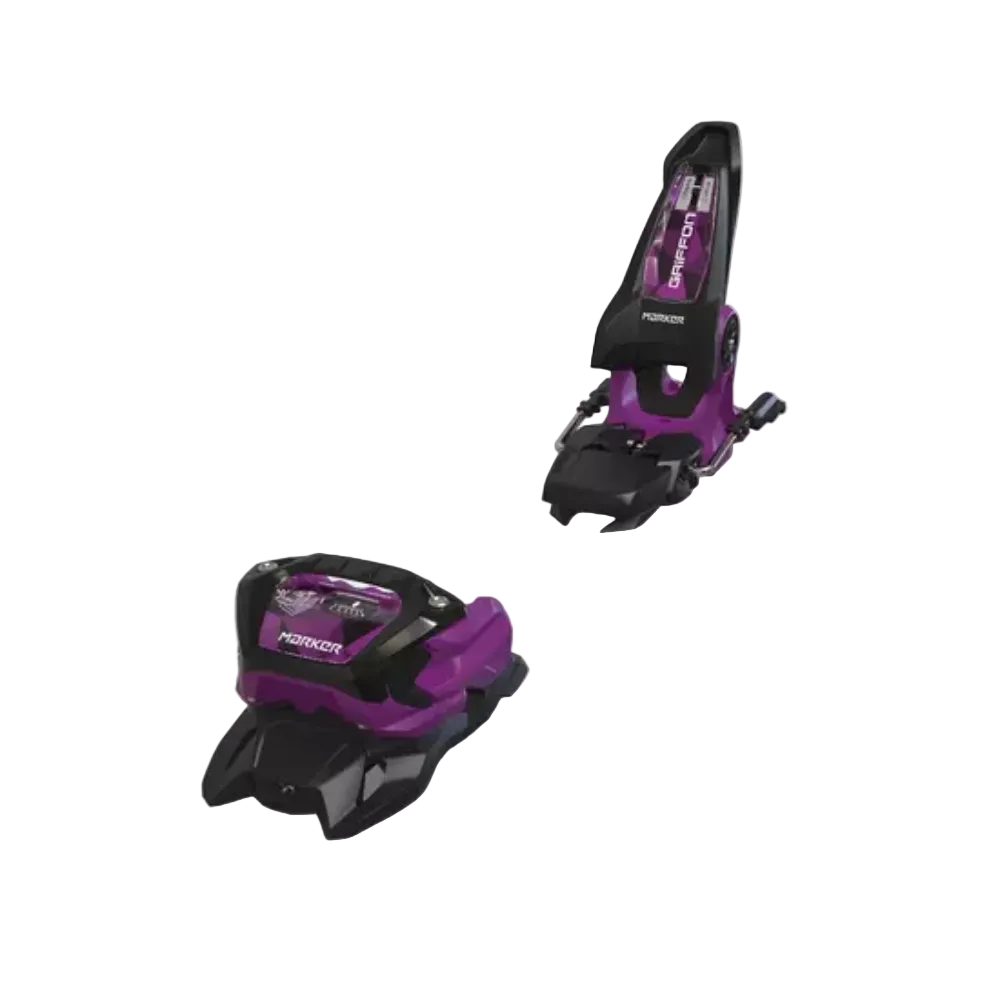Pair of purple and black ski bindings on a white background