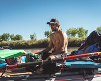 Man River Raft Boat Oars Shirtless