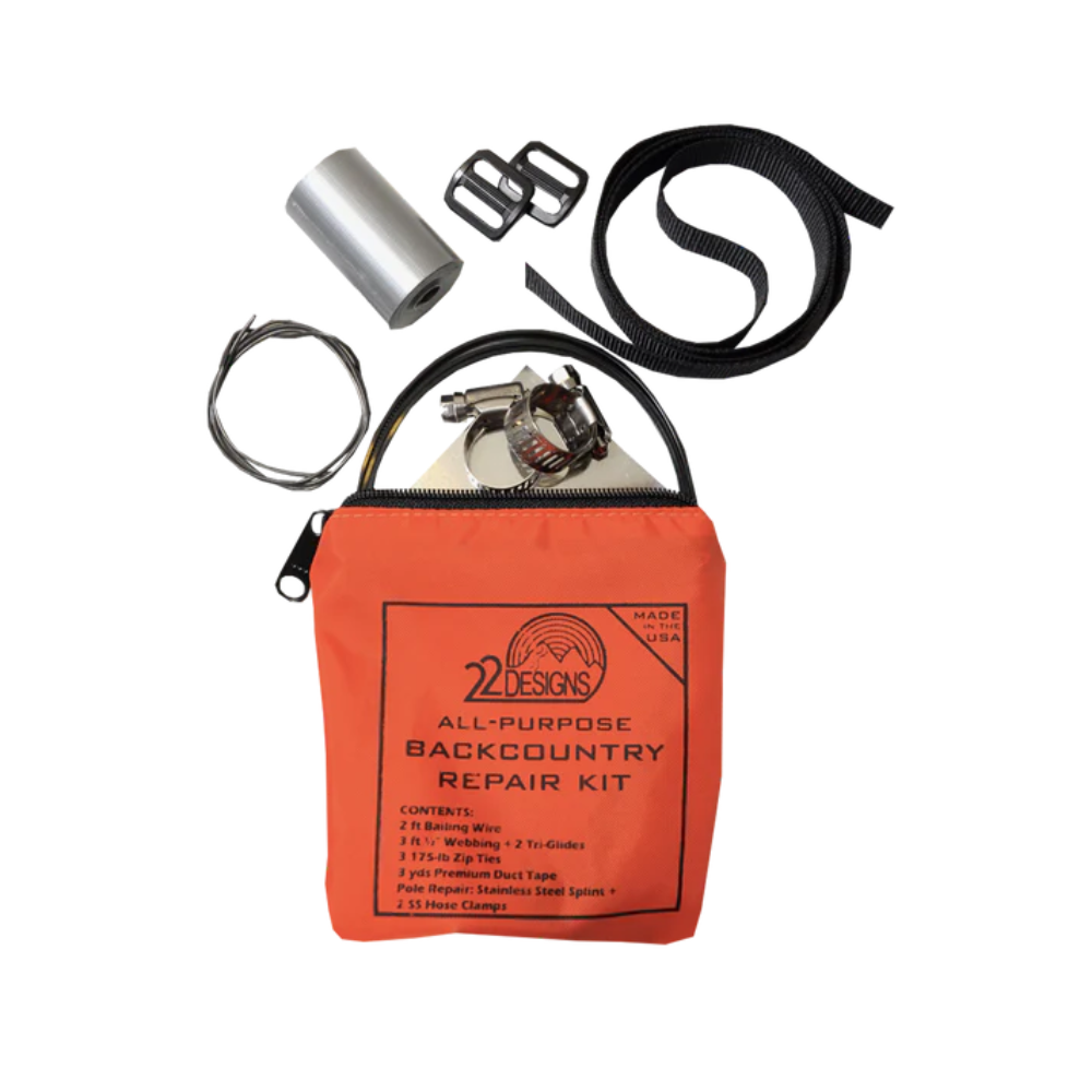 All-purpose backcountry repair kit with various tools on a white background