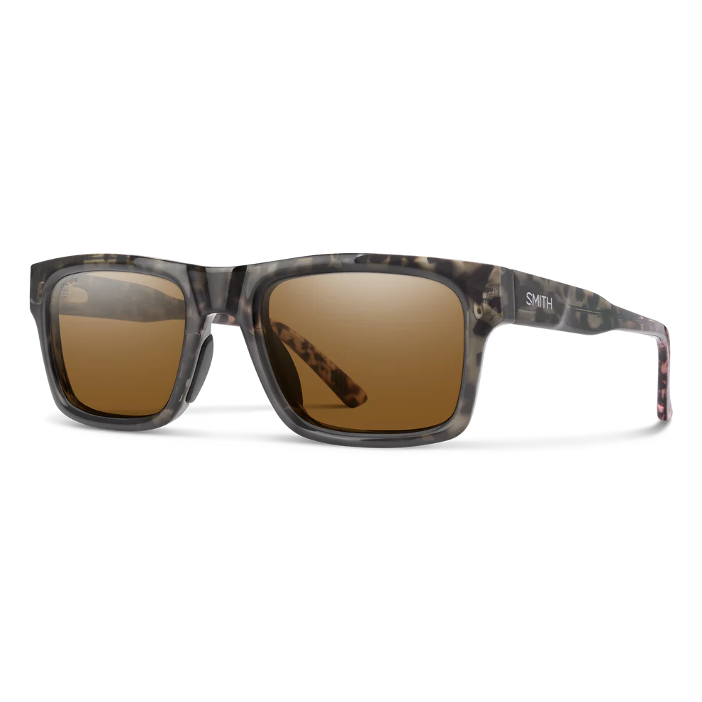 Sunglasses with camouflage frame and brown lenses on a white background